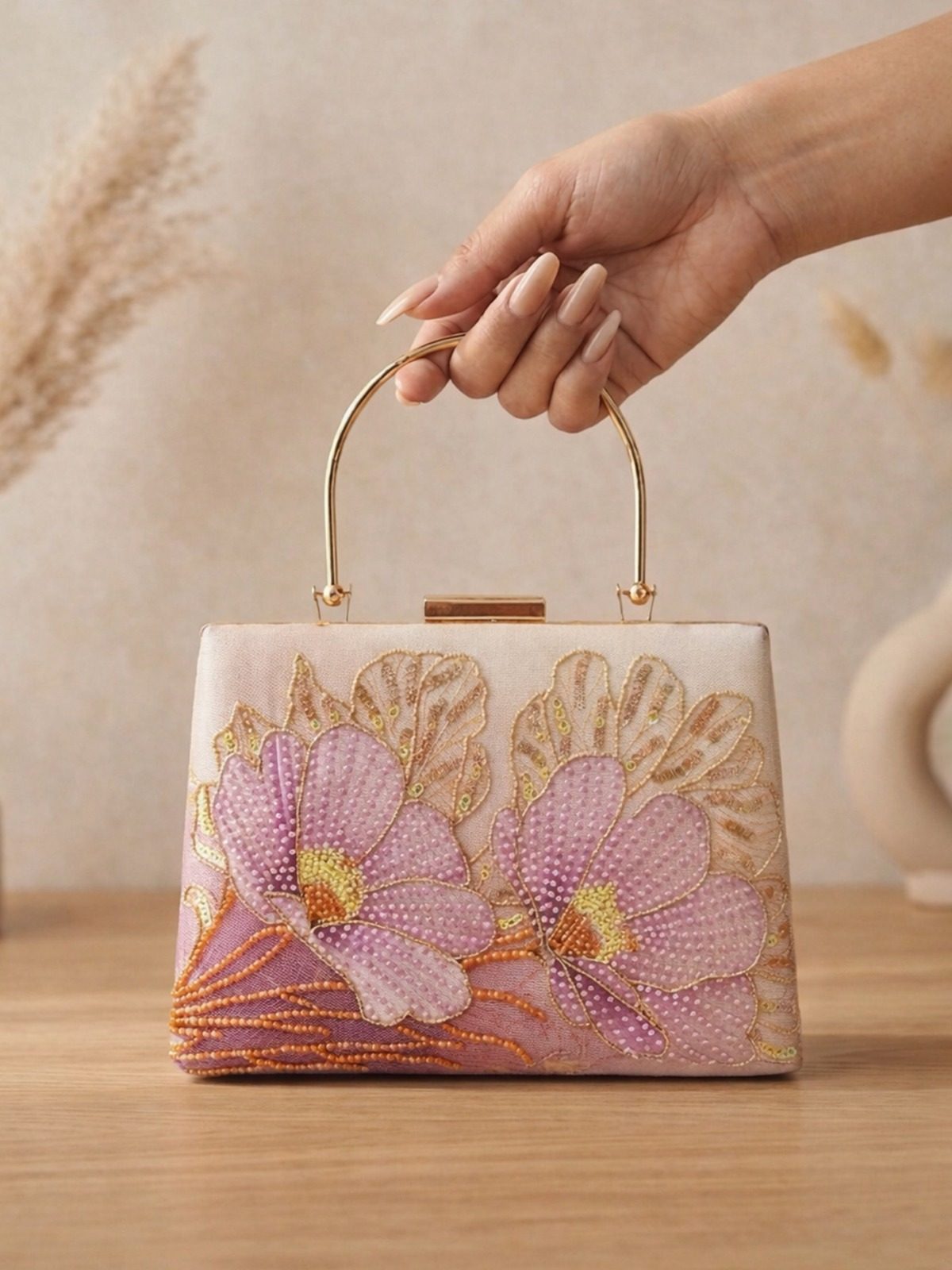 Hand embroidered festive clutch with handle and chain by Weavers 2 Buyers